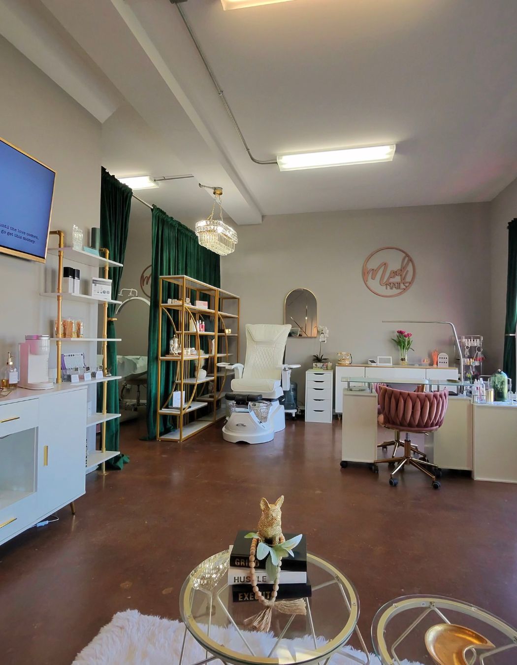 Manicure and pedicure station at Mod Esthetics with stylish seating.