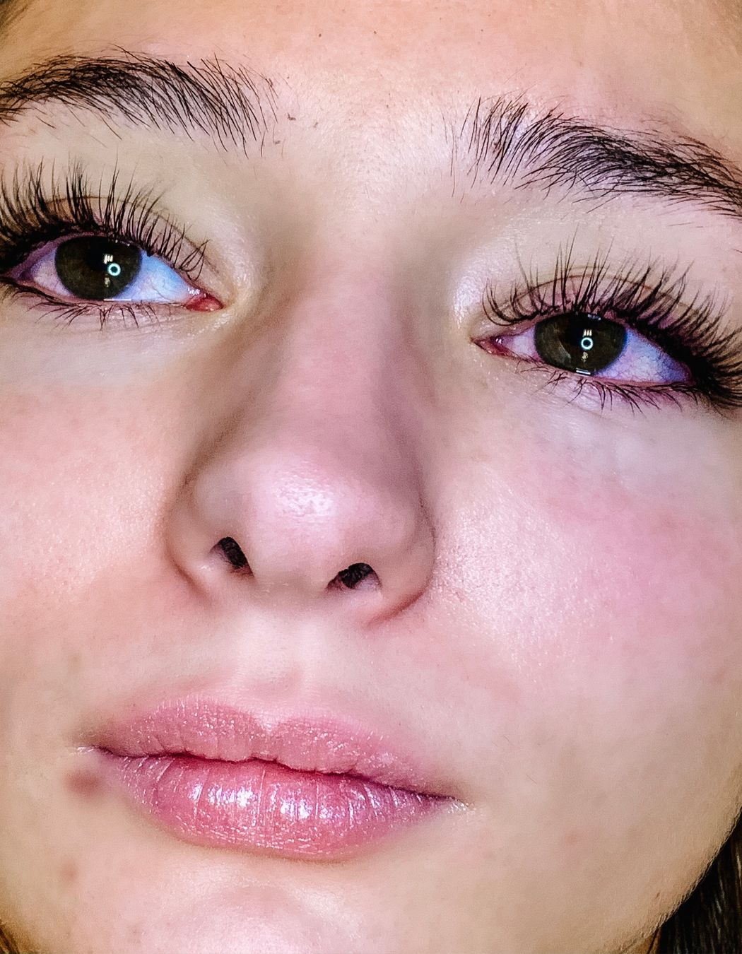 Client post lash treatment at Mod Esthetics in a calm, professional setting.