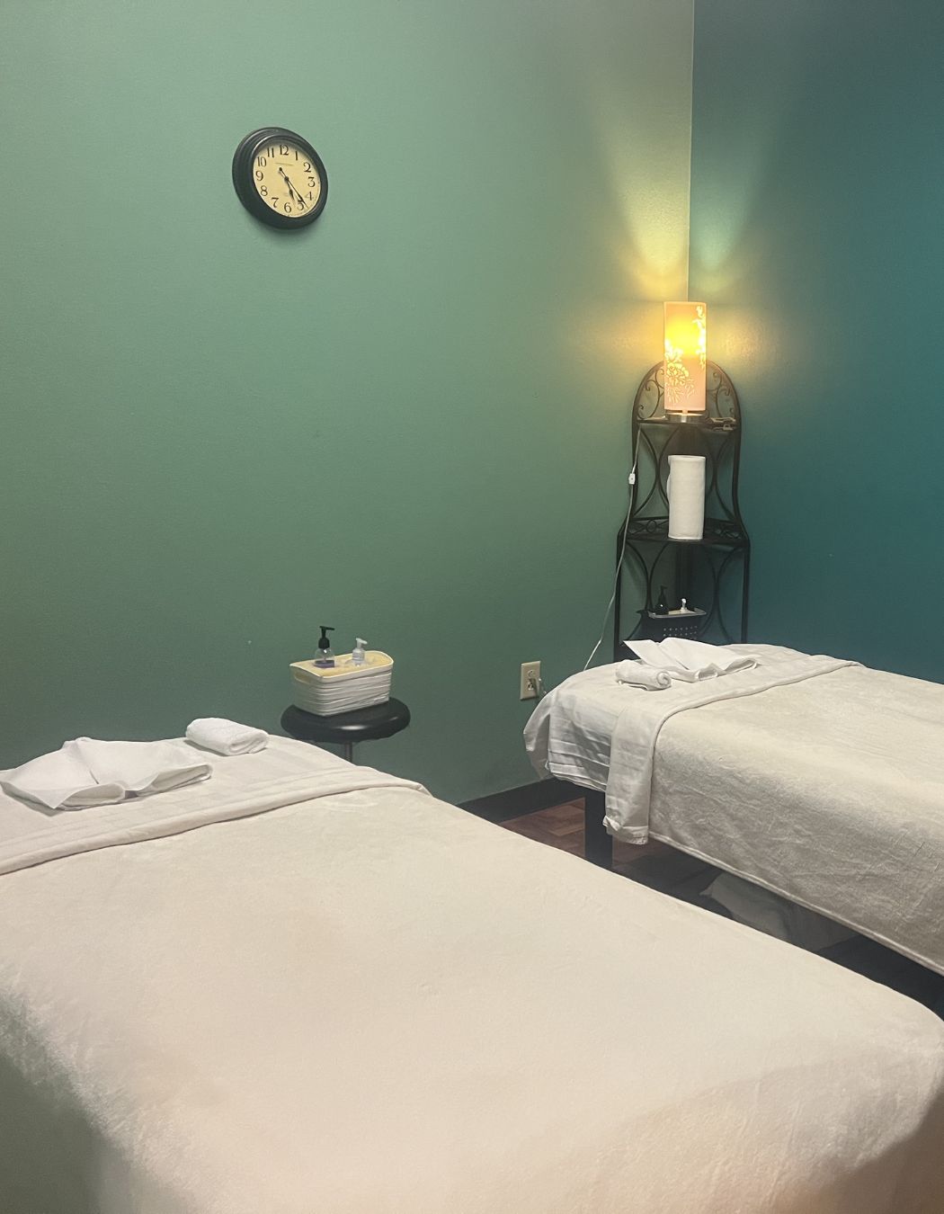 Peaceful couples treatment room at Taichi Spa in San Antonio, TX, with side-by-side massage tables for shared relaxation.