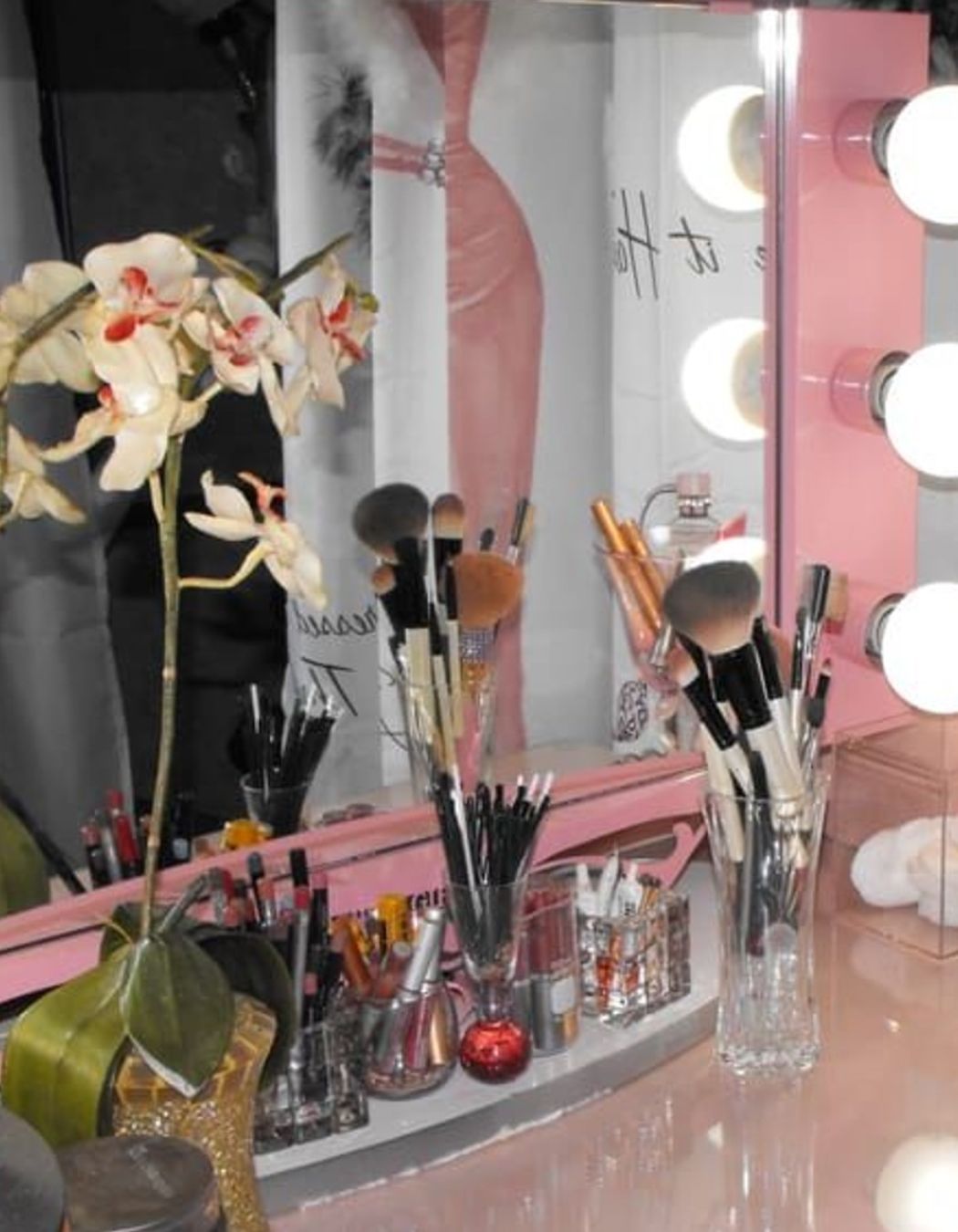Pink vanity with lights, some like it haute signage at Mac Med Spa Framingham, MA 