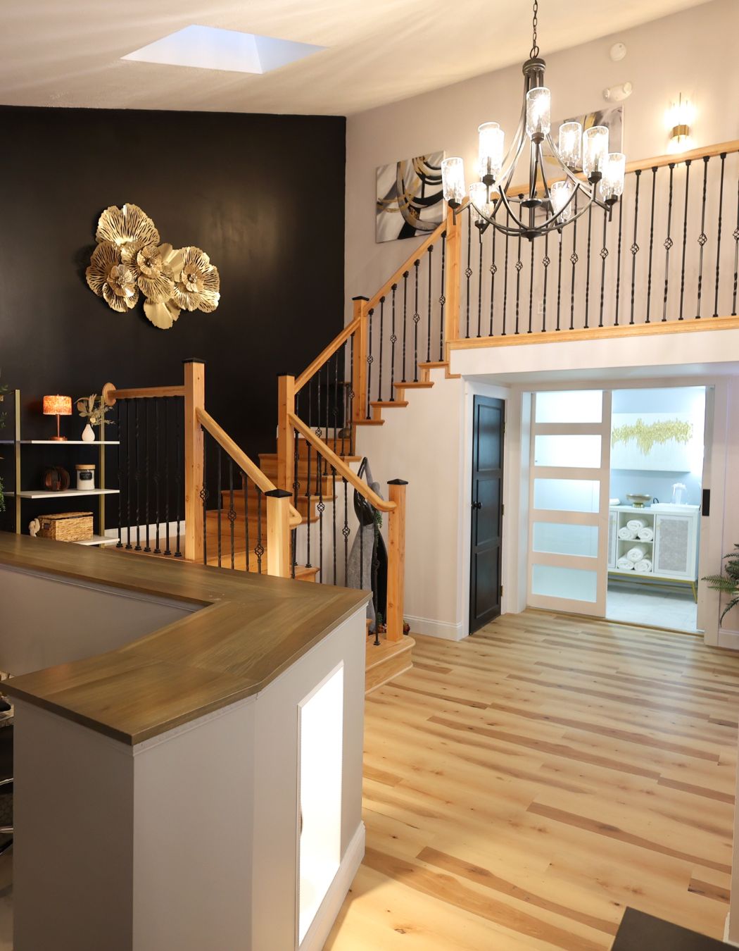 Elysian Spa at In Vogue in Oswego, New York features clean wood floors, warm ambient lighting, and a peaceful, upscale atmosphere.