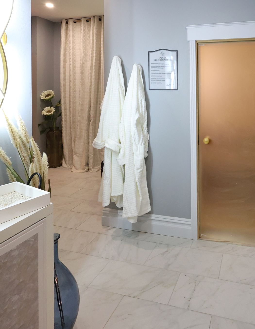 Eucalyptus steam room at Elysian Spa at In Vogue in Oswego, New York, featuring warm wood interiors and a private, relaxing atmosphere.