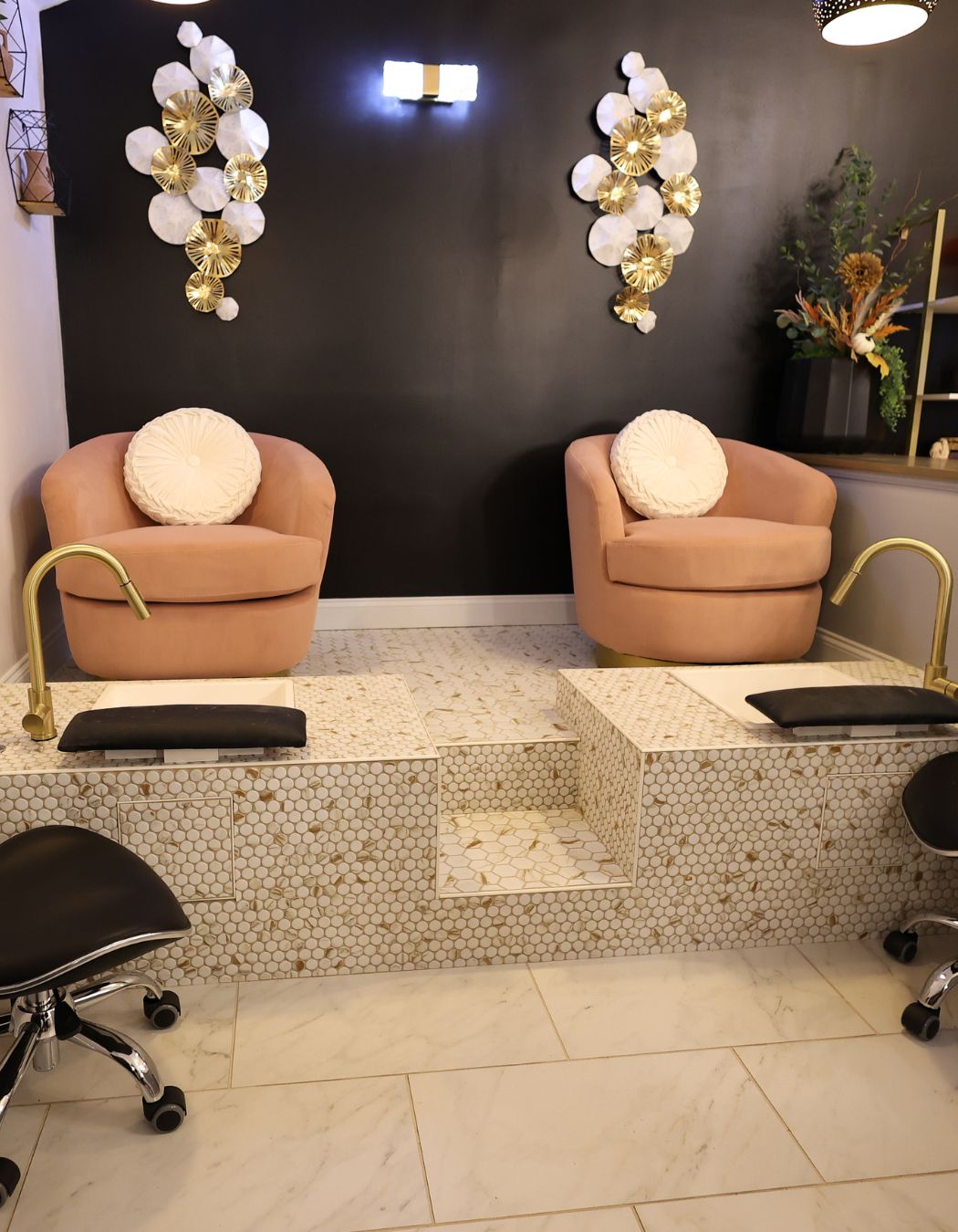 Pedicure treatment area at Elysian Spa at In Vogue in Oswego, New York, featuring two comfortable seats and a relaxing atmosphere.